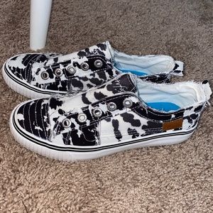 Black and white cow print blowfish slip ons. Size 6.